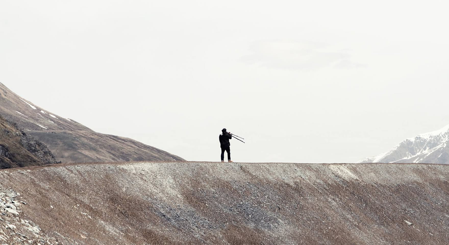 Jonathan Perfect filming in a mountain landscape in Switzerland