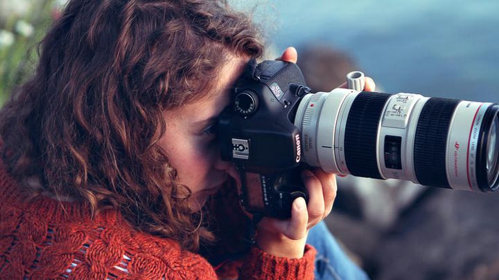OSCE multimedia intern Pauline Schreuder filming on location